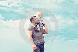 Lifestyle atmospheric portrait happy father and son having fun