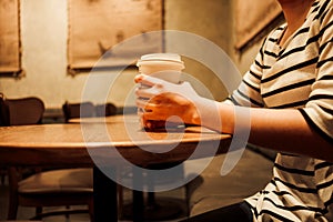 Lifestyle background woman holding coffee glass sitting alone in