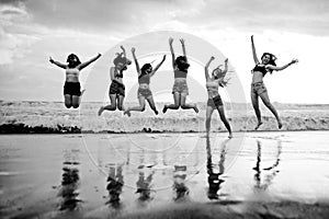 Lifestyle beach portrait of young group of Asian Korean and Chinese women , happy and attractive girlfriends enjoying Summer holid
