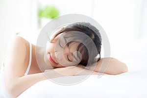 Lifestyle beautiful portrait young asian woman relax lying sleep and smile while wake up with sunrise at morning