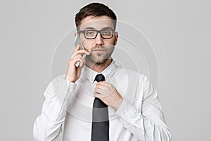 Lifestyle and Business Concept - Portrait of a handsome businessman serious talking with mobile phone. Isolated White background.