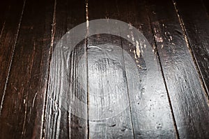 Lifestyle closeup of rustic worn and scratched wooden floor for copy