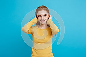 Lifestyle concept - Close up Portrait young beautiful attractive ginger red hair girl playing with her hair with shyness