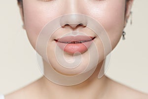 Lifestyle concept. Closeup of beautiful young woman healthy lips