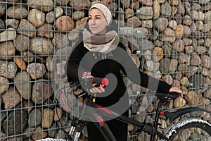 Lifestyle concept, young woman riding a sports bike in winter