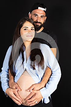 Lifestyle couple young pregnant woman with her husband waiting baby