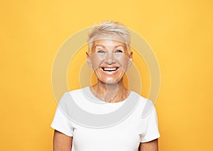 lifestyle, emotion and old people concept: Portrait of blond optimistic old lady