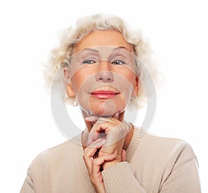 Lifestyle, emotion and people concept: Close up portrait of happy senior woman smiling