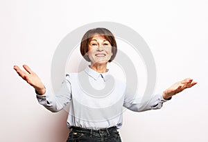 lifestyle, emotion and people concept: elderly surprised woman.