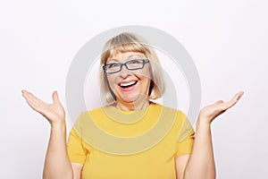 Lifestyle, emotion and people concept: old nice beautiful surprised woman.  over white background.