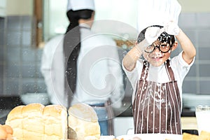 Lifestyle Family. Chef asian mother and kid boy cooking toast and make bread for dinner