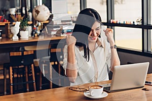 Lifestyle freelance business woman working with laptop computer he has glad on the job