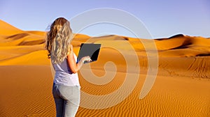 Lifestyle freelance woman using laptop working and relax in the desert