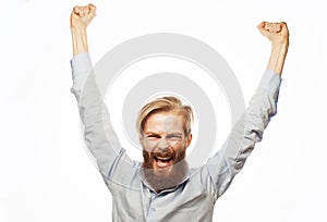 lifestyle, happiness and people concept: young positivity bearded man showing hand up and screaming