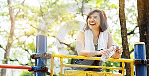 Lifestyle Happy Asian women is smiling in the great outdoors or the beautiful nature park. Enjoying the physical activity in the