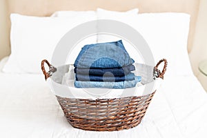 Clean and folded clothing in a laundry basket
