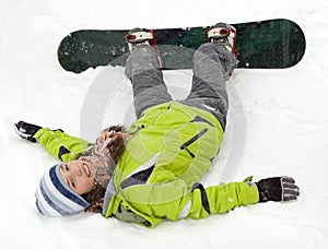 A lifestyle image of snowboarder girl