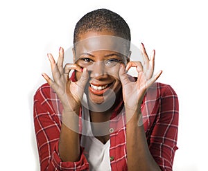 Lifestyle isolated portrait of young attractive and natural black african american woman gesturing happy celebrating success in ok