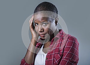 Lifestyle isolated portrait of young attractive and sad black afro American woman feeling unwell and depressed and suffering pain