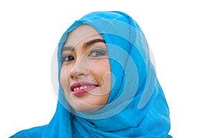 Lifestyle isolated portrait of young beautiful and happy Asian woman smiling covered by muslim hijab head scarf in islamic culture