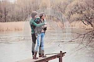 Lifestyle outdoor capture of young loving couple on the walk in early spring