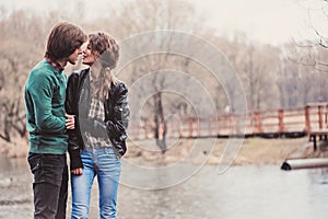 Lifestyle outdoor capture of young loving couple on the walk in early spring