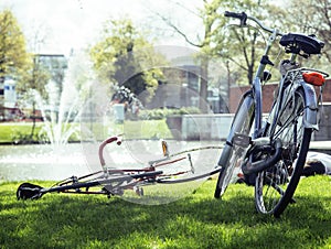 lifestyle people concept: couple of bicycle on green grass in su