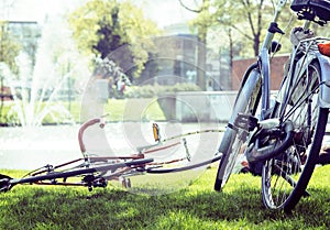 lifestyle people concept: couple of bicycle on green grass in su