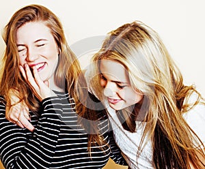 Lifestyle and people concept: Fashion portrait of three stylish girls best friends, over white background. Happy