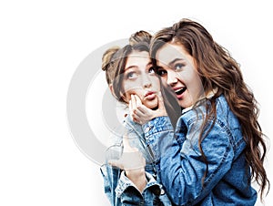 Lifestyle and people concept: Fashion portrait of two stylish girls best friends, over white background. Happy time