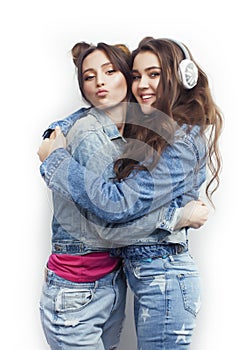 Lifestyle and people concept: Fashion portrait of two stylish girls best friends, over white background. Happy time