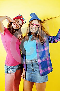 Lifestyle people concept: two pretty stylish modern hipster teen girl having fun together, happy smiling making selfie