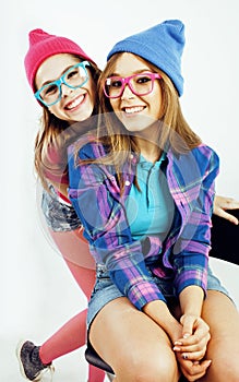 Lifestyle people concept: two pretty stylish modern hipster teen girl having fun together, happy smiling making selfie