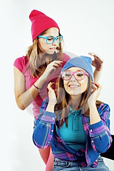 Lifestyle people concept: two pretty stylish modern hipster teen girl having fun together, happy smiling making selfie