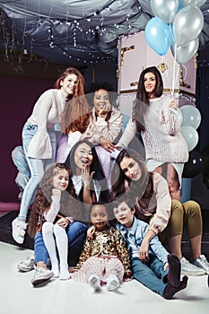 Lifestyle and people concept: young pretty diversity nations woman with different age children celebrating on birth day