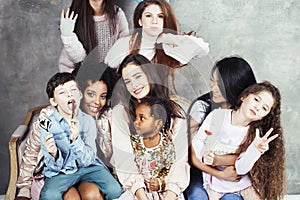 Lifestyle and people concept: young pretty diversity nations woman with different age children celebrating on birth day