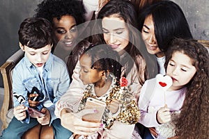 Lifestyle and people concept: young pretty diversity nations woman with different age children celebrating on birth day