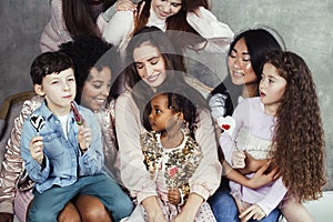 Lifestyle and people concept: young pretty diversity nations woman with different age children celebrating on birth day