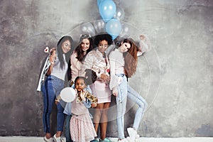 Lifestyle and people concept: young pretty diversity nations woman with different age children celebrating on birth day