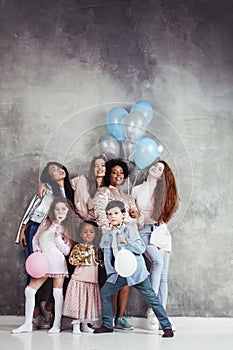 Lifestyle and people concept: young pretty diversity nations woman with different age children celebrating on birth day