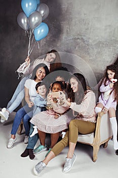 Lifestyle and people concept: young pretty diversity nations woman with different age children celebrating on birth day