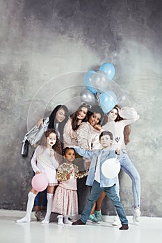 Lifestyle and people concept: young pretty diversity nations woman with different age children celebrating on birth day