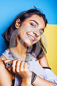 Lifestyle people concept. young pretty smiling indian girl with long nails wearing lot of jewelry rings, asian summer