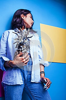 Lifestyle people concept. young pretty smiling indian girl with long nails wearing lot of jewelry rings holding