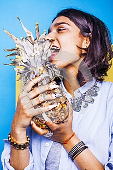 Lifestyle people concept. young pretty smiling indian girl with pineapple, asian summer fruits