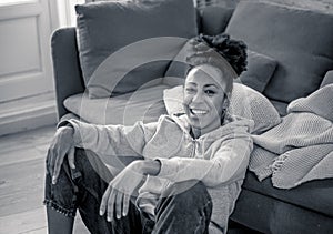 Lifestyle portrait of a beautiful young african american woman smiling at home