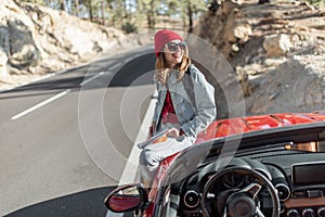 Woman tarveling by car on the mountain road