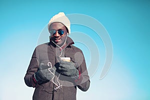 Lifestyle portrait of free young african man listening music