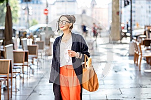 Lifestyle portrait of a french woman outdoors