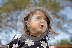 Lifestyle portrait of little toddler girl in summer time, childhood memories